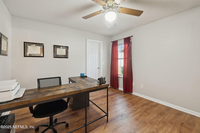 office with a textured ceiling, ceiling fan, and hardwood / wood-style floors