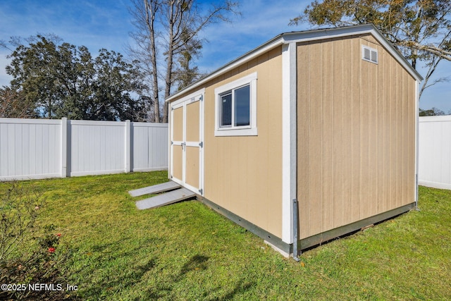 view of outbuilding with a lawn