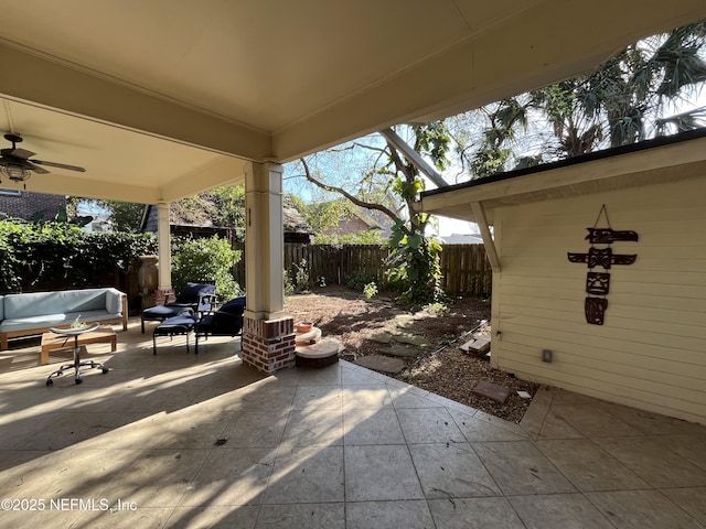 view of patio / terrace with a fenced backyard and a ceiling fan