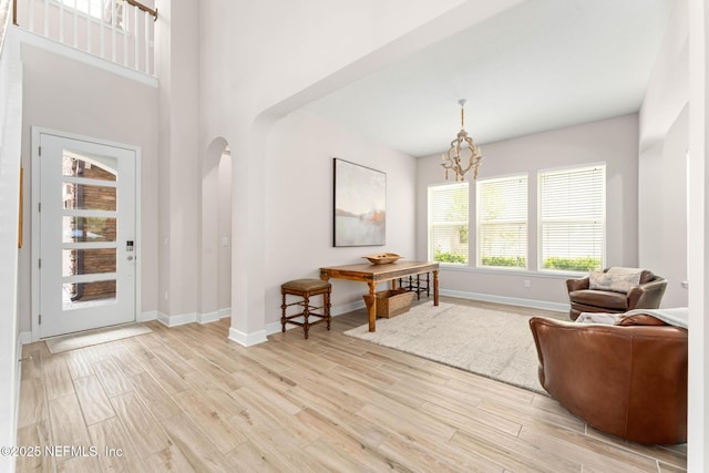 sitting room featuring light hardwood / wood-style flooring and a chandelier