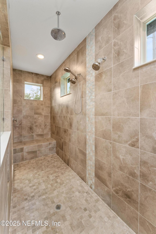 bathroom with a tile shower