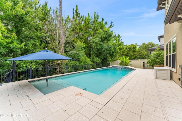 view of swimming pool with a patio area