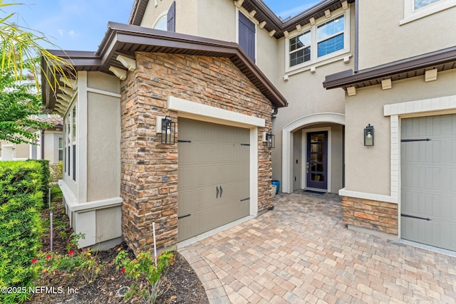 entrance to property featuring a garage