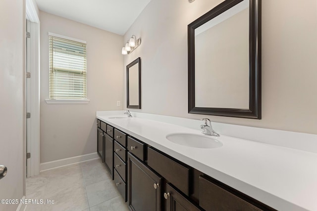 bathroom with vanity and tile patterned floors