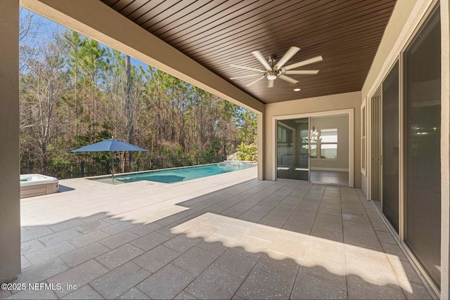 view of patio with a pool with hot tub and ceiling fan