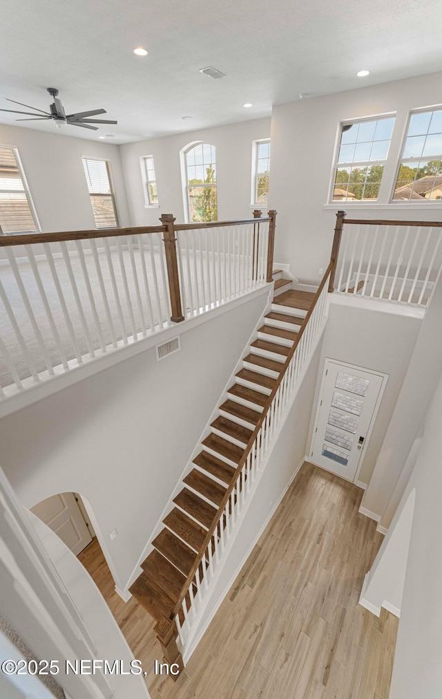 stairway with wood-type flooring