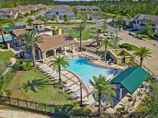 view of pool featuring a gazebo, a patio area, and a water view