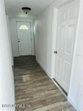 hallway with dark hardwood / wood-style floors