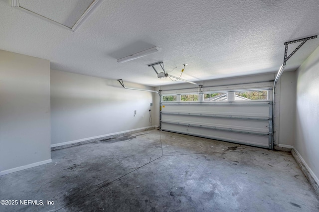 garage with baseboards and a garage door opener