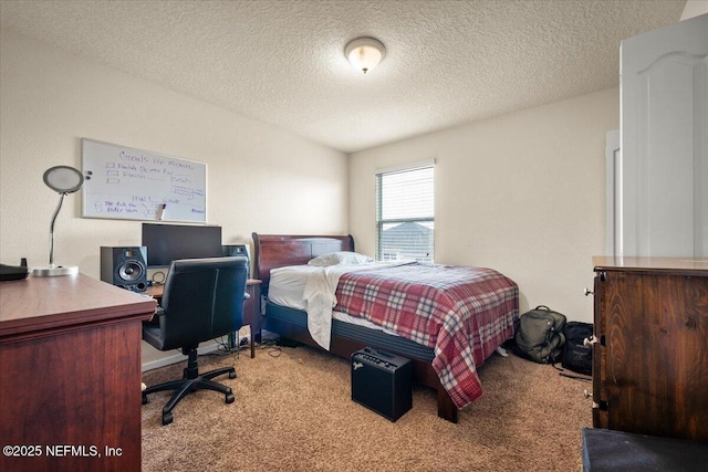 bedroom featuring a textured ceiling and light carpet