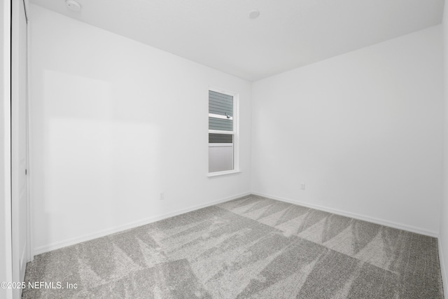 unfurnished room with carpet