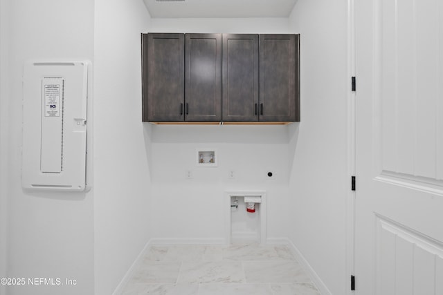 clothes washing area with washer hookup, cabinets, hookup for a gas dryer, and hookup for an electric dryer