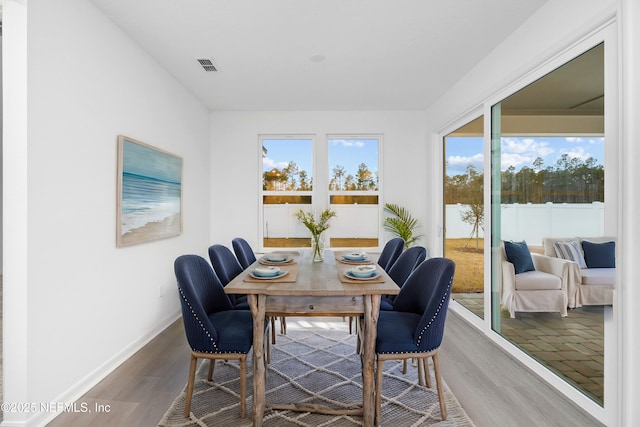 dining space featuring hardwood / wood-style flooring