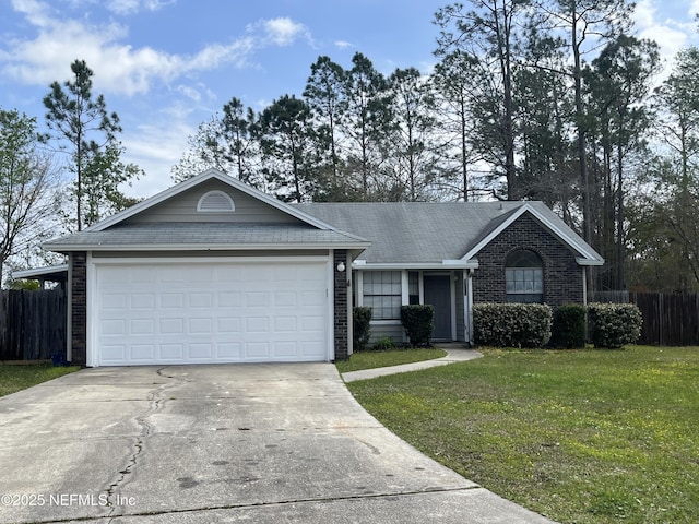 single story home featuring brick siding, a front lawn, fence, concrete driveway, and an attached garage