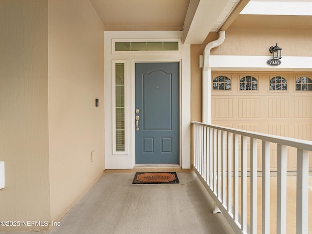 property entrance with a balcony