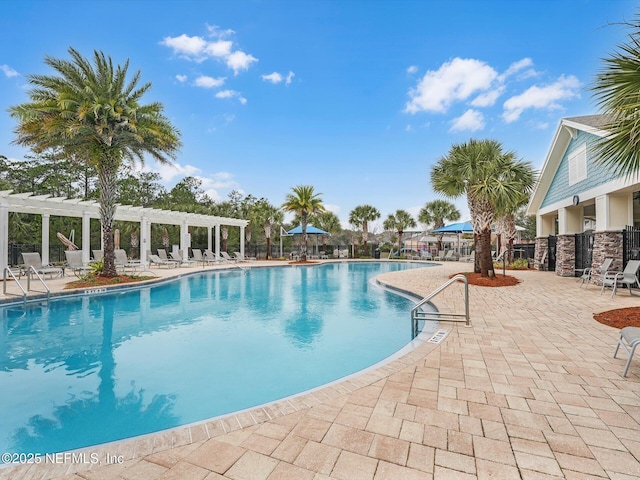 view of pool with a patio area and a pergola