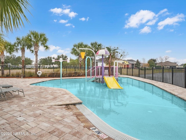 view of pool featuring a playground