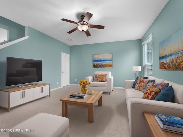 living room with ceiling fan and carpet flooring