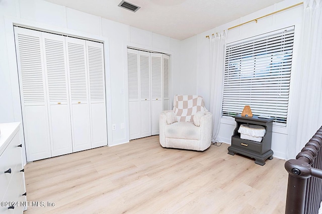 living area with light hardwood / wood-style floors