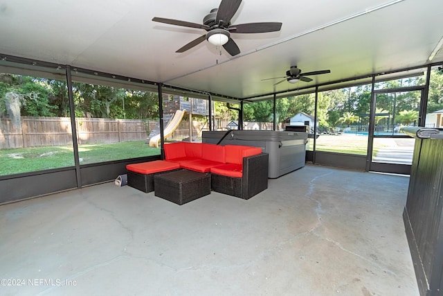 sunroom / solarium featuring ceiling fan