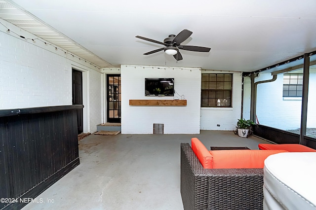 view of patio / terrace featuring ceiling fan and an outdoor living space