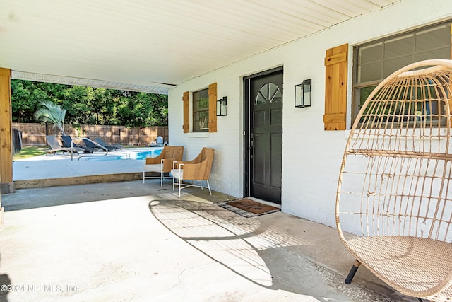 property entrance featuring a patio