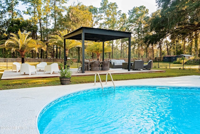 view of pool with an outdoor living space, a patio area, and a gazebo