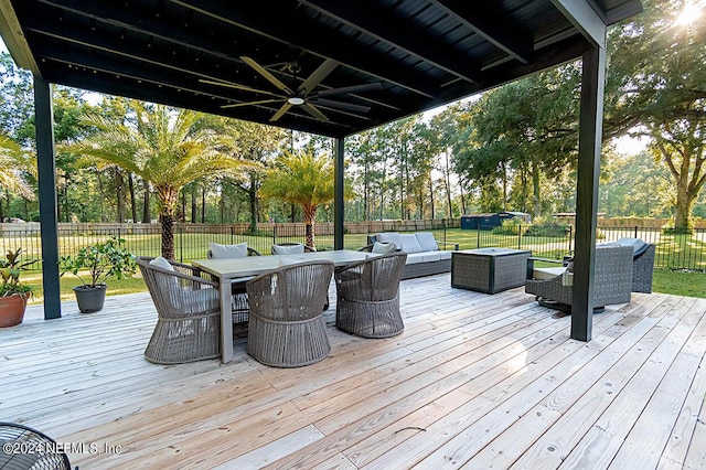 wooden terrace featuring ceiling fan and an outdoor hangout area