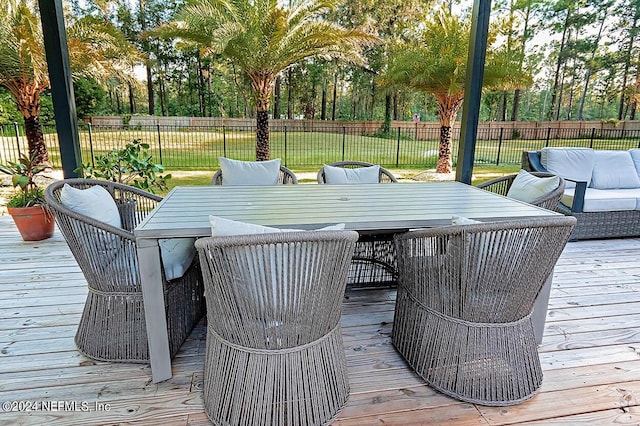 wooden terrace with outdoor lounge area