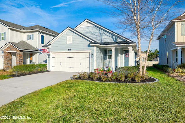 view of front of property with a garage and a front lawn