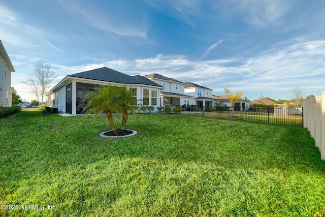 view of yard featuring a sunroom