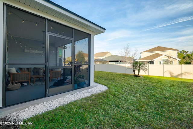 view of yard with a sunroom