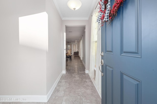 hallway featuring ornamental molding and light tile patterned flooring