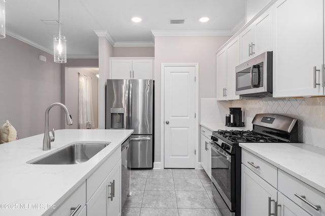 kitchen with stainless steel appliances, sink, and white cabinets