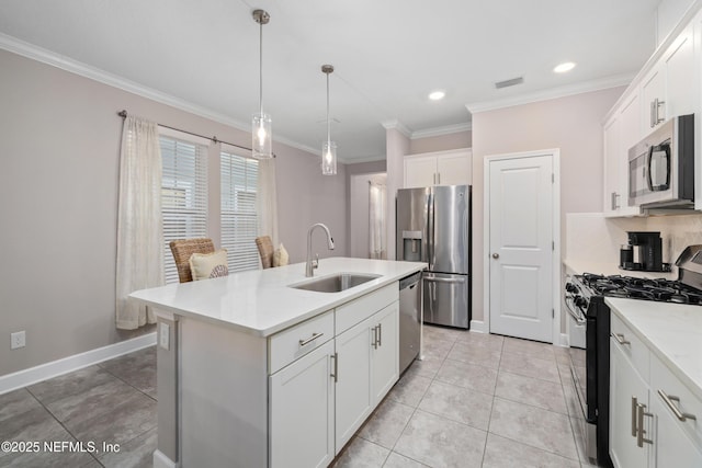 kitchen featuring sink, appliances with stainless steel finishes, white cabinetry, ornamental molding, and a center island with sink