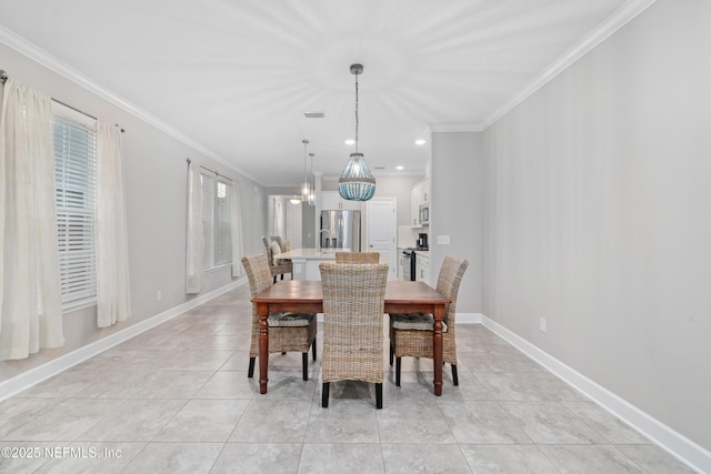 dining room with crown molding, light tile patterned flooring, and an inviting chandelier