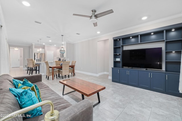 living room featuring light tile patterned floors, built in shelves, ornamental molding, and ceiling fan