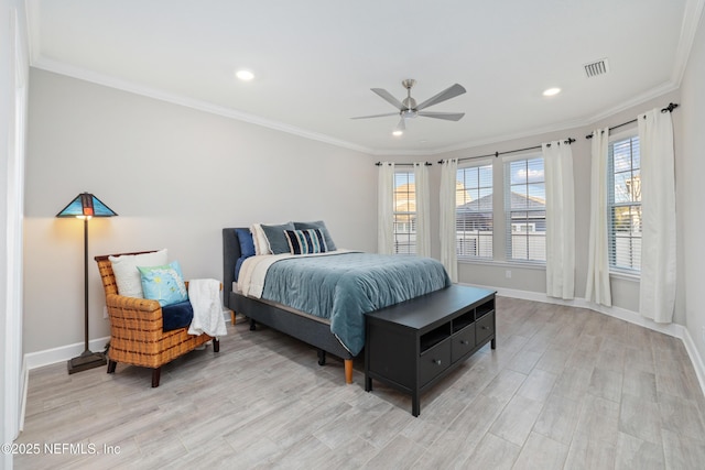 bedroom featuring multiple windows, crown molding, ceiling fan, and light wood-type flooring