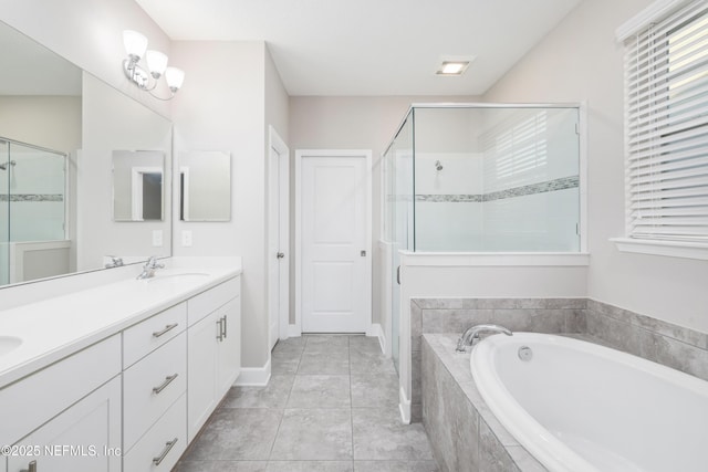 bathroom featuring tile patterned flooring, vanity, plenty of natural light, and independent shower and bath