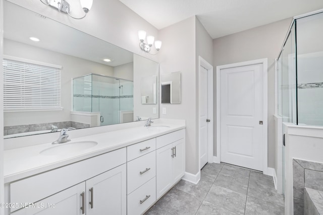 bathroom featuring tile patterned floors, vanity, and plus walk in shower