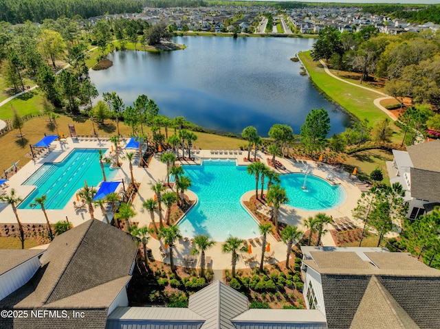 view of swimming pool featuring a water view