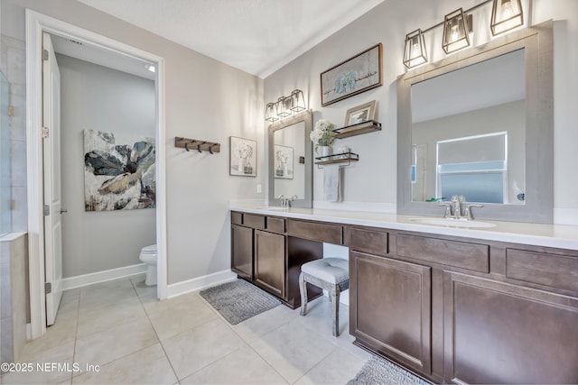 bathroom with vanity, tile patterned floors, and toilet