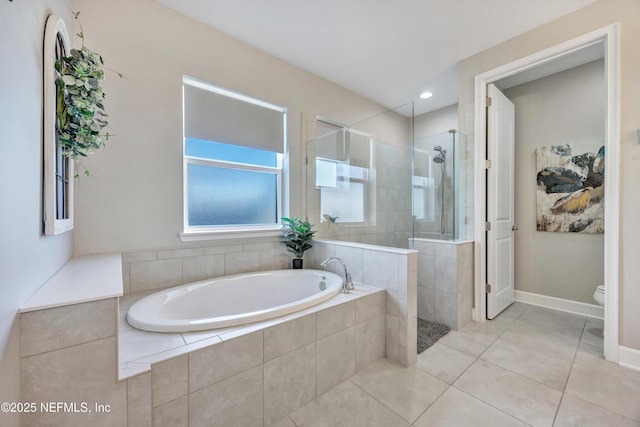 bathroom with tile patterned flooring, separate shower and tub, and toilet