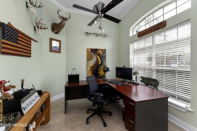 office space with ceiling fan and crown molding