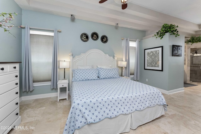 bedroom featuring ceiling fan and connected bathroom