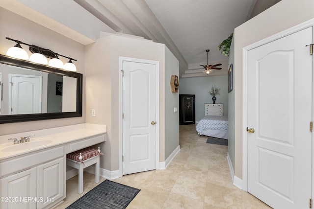 bathroom featuring ceiling fan, a textured ceiling, vanity, and tile patterned flooring