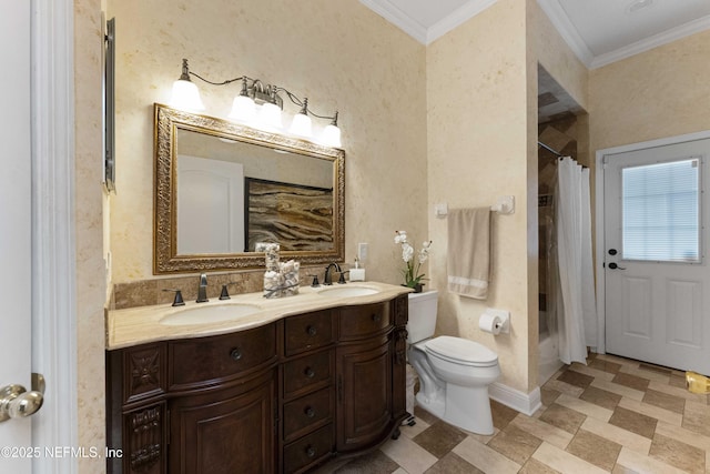 bathroom with toilet, vanity, ornamental molding, and curtained shower