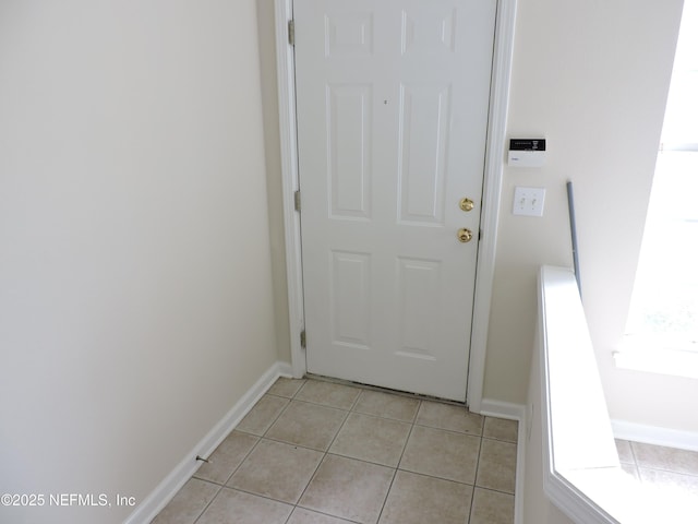 entryway featuring light tile patterned floors