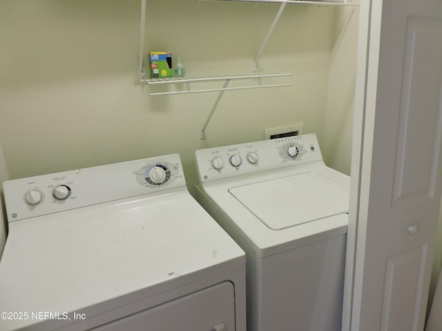 clothes washing area with independent washer and dryer