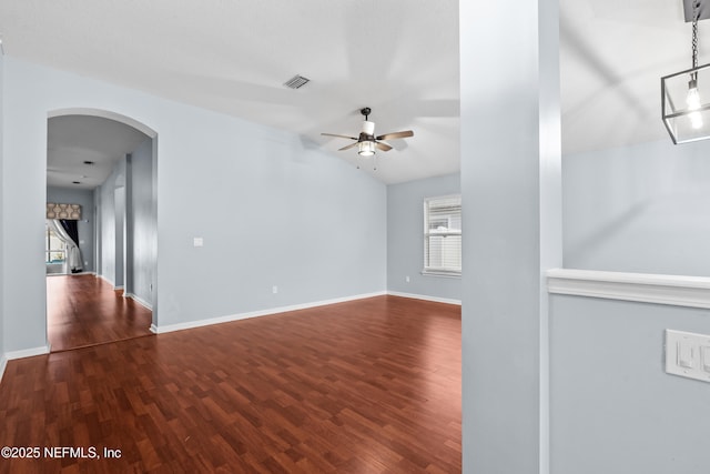 unfurnished living room with hardwood / wood-style flooring, ceiling fan, and a healthy amount of sunlight